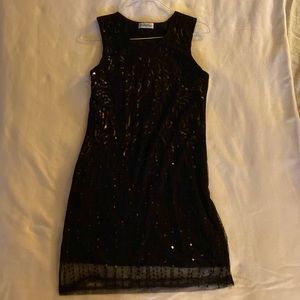 Classic black dress with sequins overlay